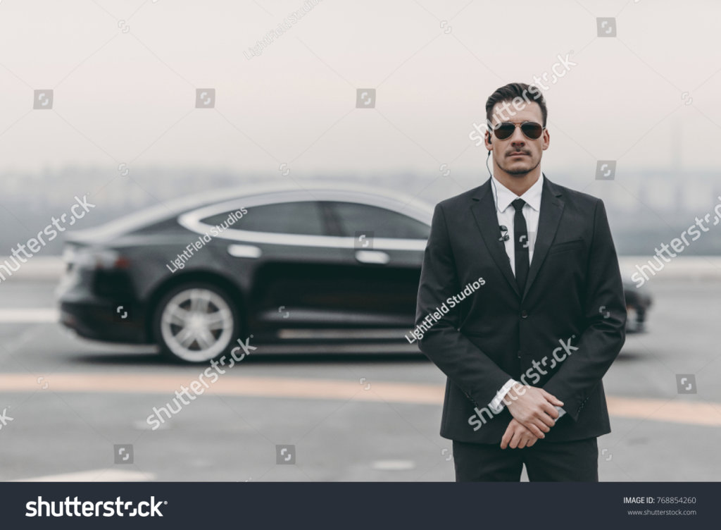 stockphotoseriousbodyguardstandingwithsunglassesandsecurity